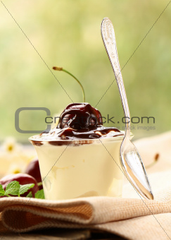 dessert  dairy with cherries and chocolate sauce