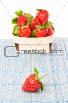 Strawberries in a basket. On a white background.