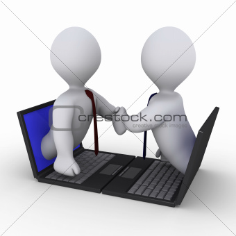 Businessmen handshake through laptop