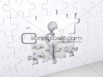 Person holding puzzle piece about to complete vertical puzzle