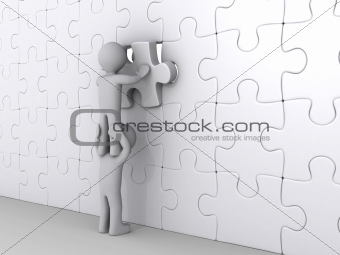 Person on top of another putting last piece of puzzle