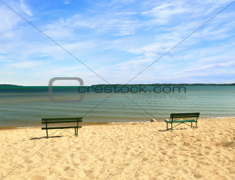 empty beach with benches 