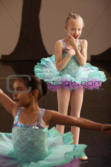 Young Ballet Student Watches Friend