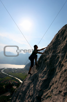 Silhouette of female rock climber