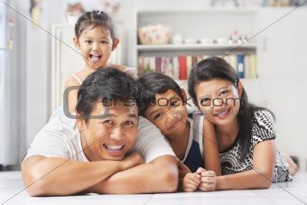 Asian family posing on the floor