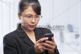Asian businesswoman using cell phonr