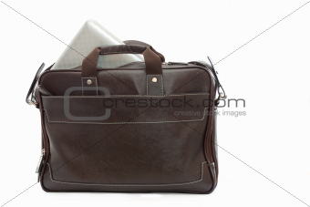 brown bag with computer over white background