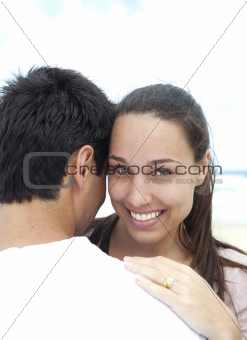 Young woman and boyfriend on the beach