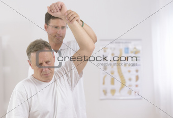 Physiotherapy: Senior man and physiotherapist