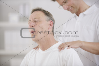 Physiotherapy: Physiotherapist massaging patient