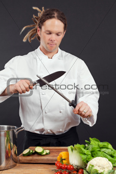 Chef sharpening his knife