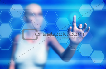 Woman touching virtual buttons on large screen
