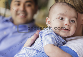 Happy Attractive Mixed Race Couple Burping Thier Smiling Son.