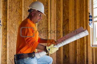 Male Construction Worker Reading Blueprints