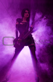 Sexy woman playing guitar 