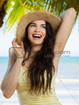 Happy young woman on tropical beach