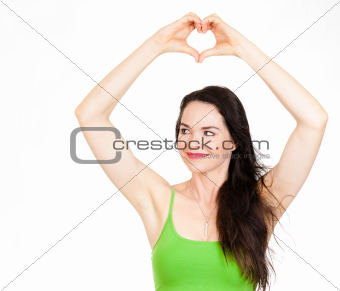 Beautiful woman forming love heart with hands