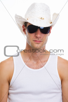 Portrait of young man in sunglasses and holiday hat