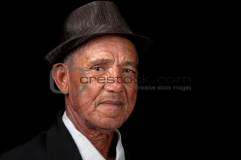 Serious old man with hat