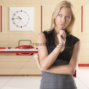 blonde business woman, with thoughtful expression
