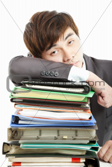 tired Businessman with  paperwork 