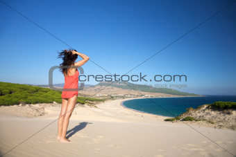 woman at top of Bolonia beach
