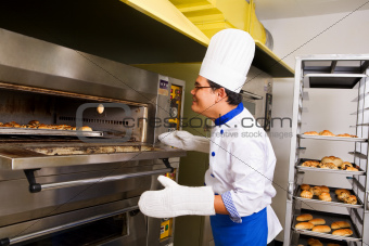Checking the bread inside oven
