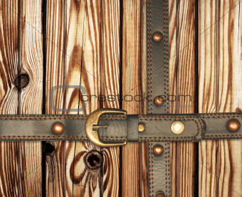 Old wooden boards and leather belt