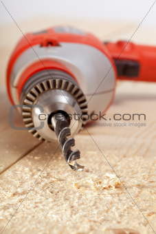 Drill on wooden surface