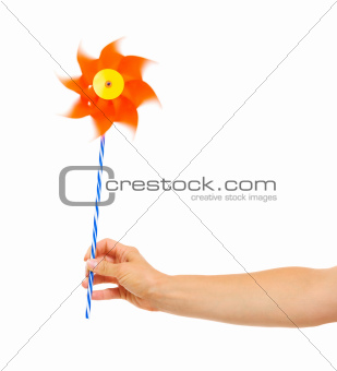 Closeup on hand holding pinwheel
