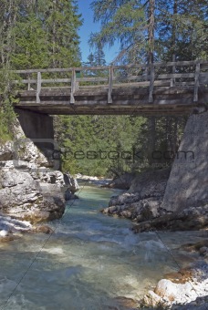 Bridge cross River in Dolomites