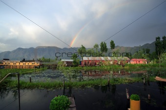Rainbow over houseboats