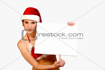 Christmas girl holding up a white sign for copyspace