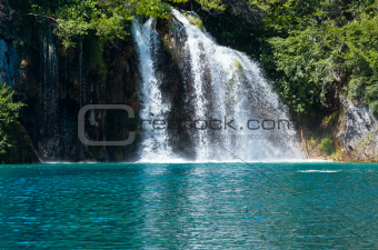 Waterfall and sea-green lake in Plitvice Lakes National Park (Cr