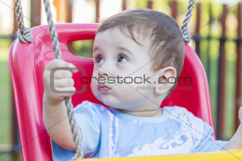 baby boy in swing