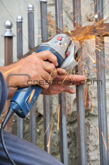 Worker hands with grinder