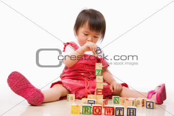 Asian female toddler playing