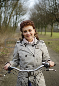 Happy woman riding a bicycle