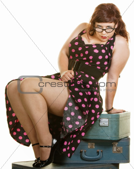 Lady Sitting on Suitcases