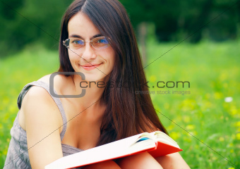  Portrait of a young  female with a book