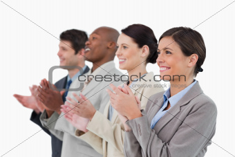 Side view of applauding salesteam