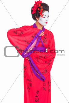 Portrait of geisha dancing isolated on white