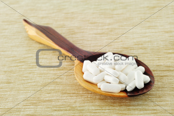 The pills on ladle spoon