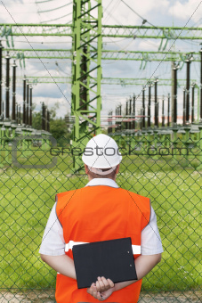 Engineer near the electricity substation