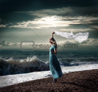 Dark Photo of Blonde Woman with White Scarf at Stormy Sea