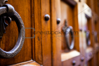 Metal Knocker on ancient wooden door