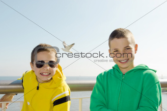Two smiling boys on deck