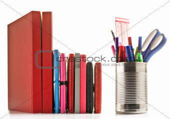 Stationery and books on white background