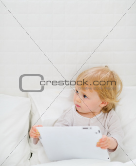 Modern baby with tablet PC