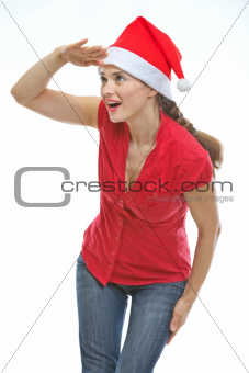 Young woman in Christmas hat looking into distance